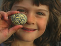 Little girl holdng a rock